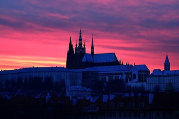 Naklejka premium Prague Castle in silhouette under the bright, dramatic sky, travel destination