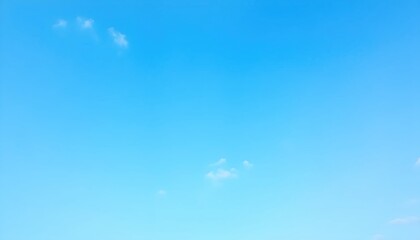 A breathtaking blue sky adorned with fluffy white clouds