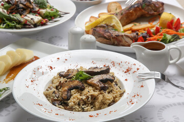 Various Mediterranean dishes served on the restaurant table	