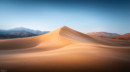 Fototapeta premium Golden sand dune landscape under a serene sky