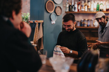A group of friends socializing at a lounge bar while enjoying relaxed conversation and atmosphere.