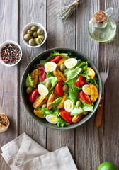 Salad with potatoes, tomatoes, olives and eggs. Healthy food. Vegetarian food.