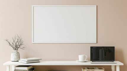 A white rectangular frame displayed above a side table in a living room with a cup, laptop, and books stacked nearby. HD 8K mockup wallpaper Photographic Image
