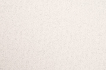 Close up of white handmade paper texture background, showcasing intricate details of cotton fibers embedded within the sheet, creating a unique and textured surface