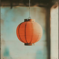Obraz premium Rustic Orange Paper Lantern Hanging Indoors