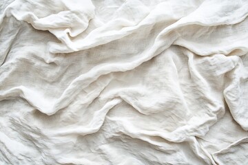 Obraz premium Textured white fabric draped elegantly on a soft surface creating an inviting atmosphere for decor or photography
