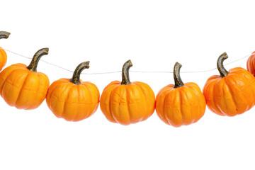 Obraz premium Row of small orange pumpkins hanging on a thin white string against a Isolated on white transparent background