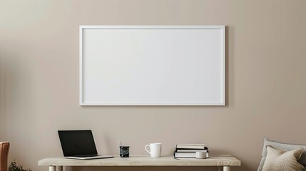 A white rectangular frame hanging above a side table in the living room with a cup, a laptop, and a few books HD 8K mockup wallpaper Photographic Image