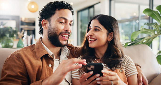 Home, relax and couple on sofa, cellphone and talking with social media, subscription or relationship. App, man or woman with smartphone, love or email notification with message, internet or marriage - Powered by Adobe