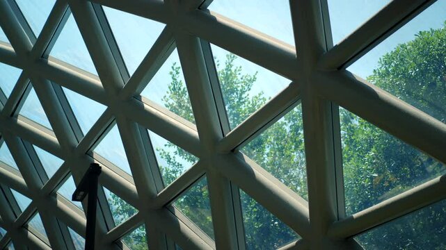 Green buildings with lush trees surround urban offices, blending sustainability and modern technology. Perfect harmony of nature and architecture, promoting eco-friendly and sustainable city living.
