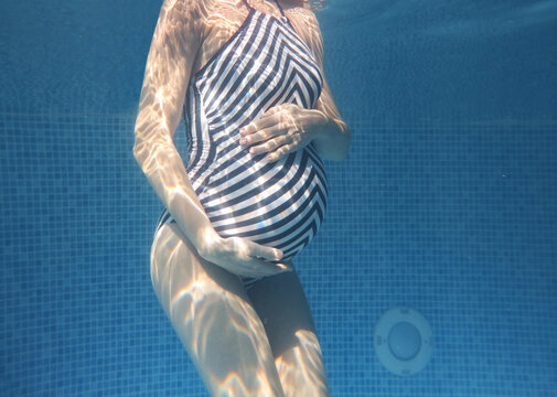 Pregnant woman in the pool.