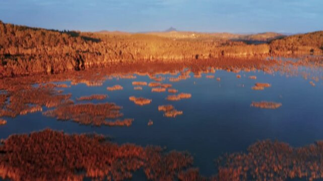 Soar over a Golden Lake to Mt Warning NSW, with stunning 4K drone footage. Golden reflections, lush landscapes iconic peaks make this perfect stock footage for travel, nature, and cinematic projects.