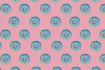 Lots of sky-blue donuts on a pink background.