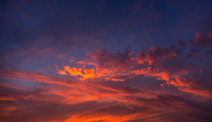 Fototapeta premium Stunning dramatic sunset sky with purple clouds and pink and red firmament texture banner