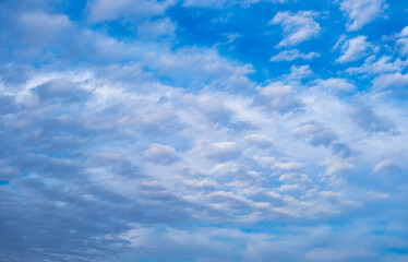 Fototapeta premium Sky clouds nature background. Stunning view of white clouds and gradient blue sky