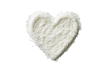 White heart shaped salt on black background,