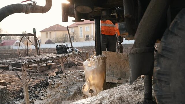 Rotary drill rig drilling water well borehole closeup shot
