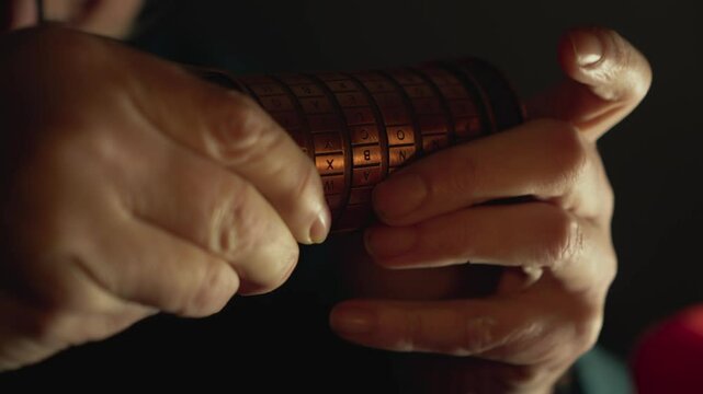 Man in Candlelit room trying to solve cryptex puzzle CLOSE-UP of hands