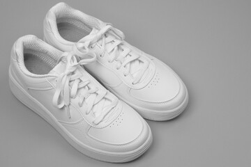 White Sneakers on grey Background