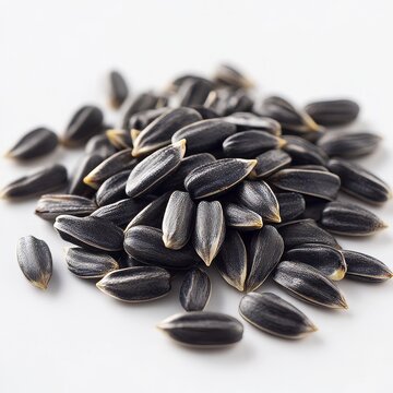 Close-up of delicious sunflower black seeds, isolated on white background
