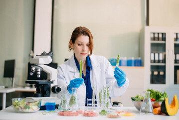Fototapeta premium Scientist testing food samples in lab with microscope, vegetables, and meat for safety, nutrition, and biotechnology