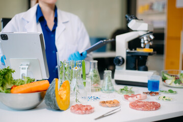 Scientist analyzing food samples in modern lab with advanced equipment for safety, nutrition, and biotechnology research.