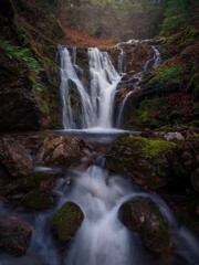 Obraz premium Serene waterfall in lush forest, Greece