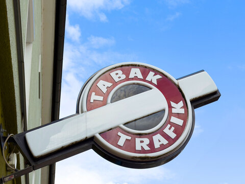 Tabak trafik store sign against blue sky in urban setting