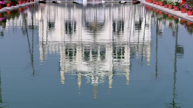 A shot of Chota Imambara Reflection on water at Husainabad in Lucknow, India