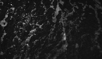 Obraz premium Black foamy water top view 