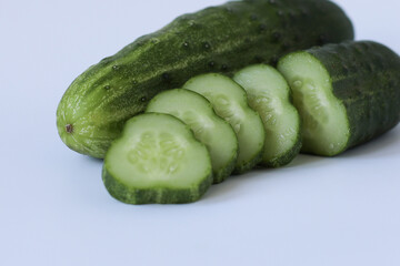cucumber and slices. cucumbers on a wooden table	