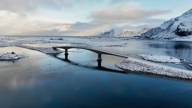 Incredible drone view of Fredvang bridge in Lofoten islands. Bird's eye view of Norway landscape. Sandbotnen beach, Fredvang village, Lofoten islands.