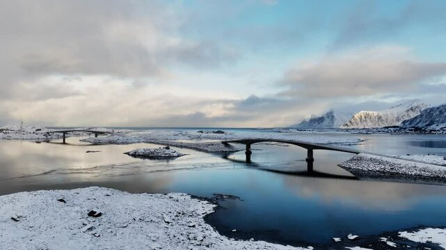 Incredible drone view of Fredvang bridge in Lofoten islands. Bird's eye view of Norway landscape. Sandbotnen beach, Fredvang village, Lofoten islands.