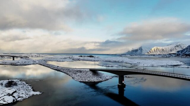 Incredible drone view of Fredvang bridge in Lofoten islands. Bird's eye view of Norway landscape. Sandbotnen beach, Fredvang village, Lofoten islands.