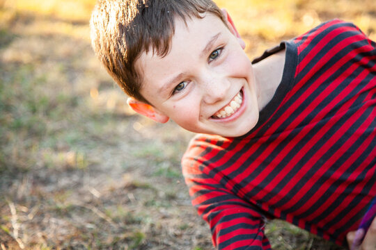 Ten year old boy with big grin on face