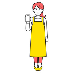 スマートフォンの画面を見せるエプロン姿の女性（全身）