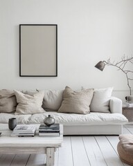 Minimalist living room with beige linen sofa, pillows, and coffee table.