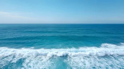 Store enrouleur Vagues de l'océan Serene and captivating seascape showcasing the fluid motion and intricate patterns of ocean waves in shades of deep blue and pristine white  © Rfoto