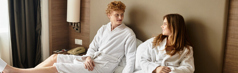 Young couple enjoying a cozy moment together at a beautiful hotel room in leisure time