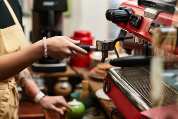Young woman expertly crafts coffee in a cozy cafe setting during the afternoon rush