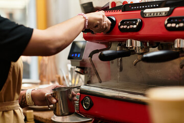 Crafting the perfect brew at a lively cafe with a warm atmosphere