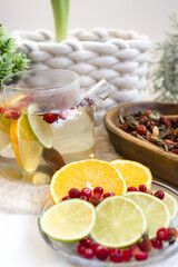 Cranberry, lemon and lime tea with cinnamon sticks. An alternative medicine for colds and flu