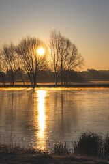 Sunrise over the lake. Sunny March morning.