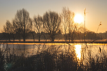 Sunrise over the lake. Sunny March morning.