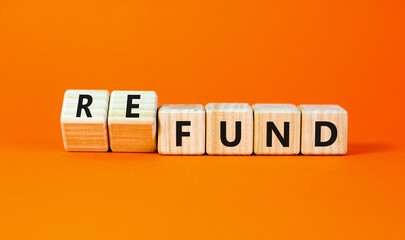 Fund or refund symbol. Concept words Fund Refund on wooden cubes. Beautiful orange table orange background. Business and fund or refund concept. Copy space.