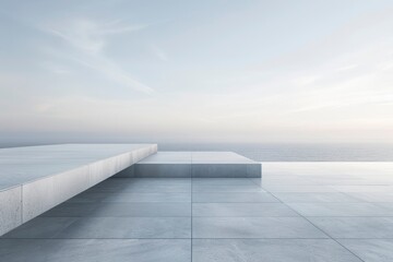 Obraz premium Tranquil Seaside View with Modern Concrete Platforms Overlooking Calm Ocean Horizon at Dusk