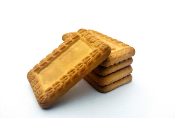 Indian biscuits stacked over white background