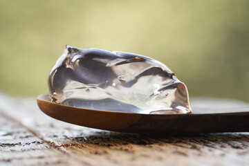 Closeup of aloe vera gel on a wooden spoon