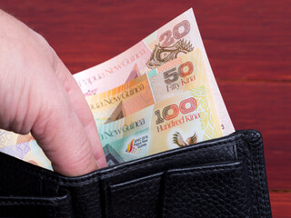 Papua New Guinean kina in the black wallet
