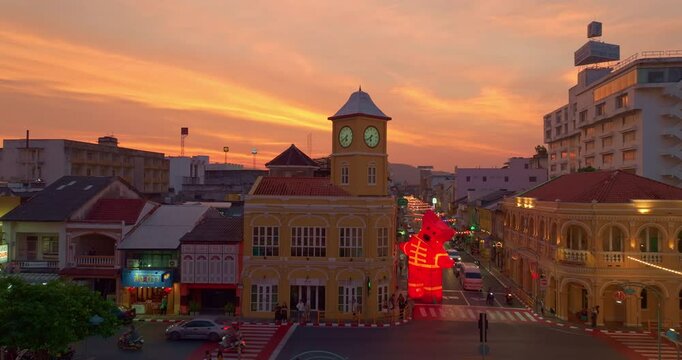 Phuket,Thailand-January,20,2025: Stunning sky in sunset above Phuket Old Town Thailand, showcasing its iconic Sino-Portuguese architecture. The illuminated streets and festive red lantern decoration